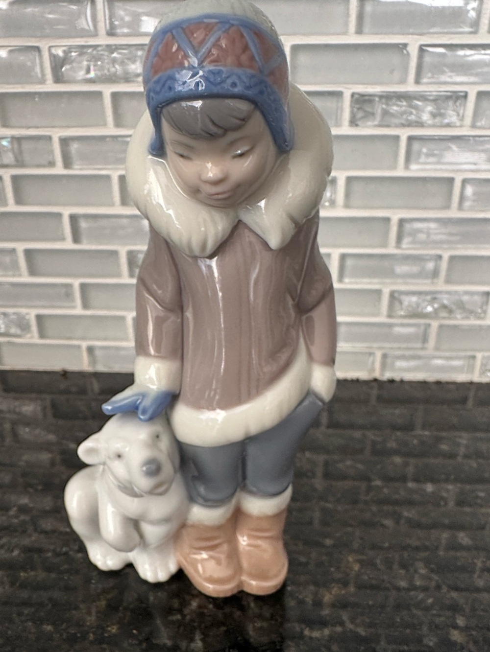 Lladró porcelain figurine titled "Eskimo Boy with Pet" (Model #5238) Vintage